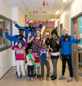 The Glasgow Children's Hospital Charity Christmas decorating day at The Royal Hospital for Children Glasgow with decorations funded by Rangers Charlity foundation. Picture shows back row L to R: Rangers U17 players John Balde, Dapo Mebude, Tickles the Clown, Biola Adosun & Nathan Patterson. Front row: Katie Milliken (10, from Clarkston), Susan Adosun (4, from Glasgow) with her sister Sandra Adosun (8) in Ward 2B.